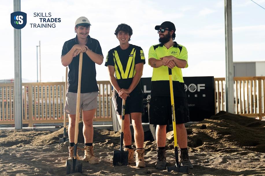 Three apprentices taking a break from digging
